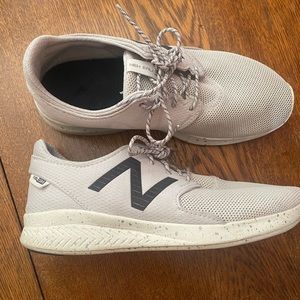New Balance women size 7.5, men size 6 off white/grey